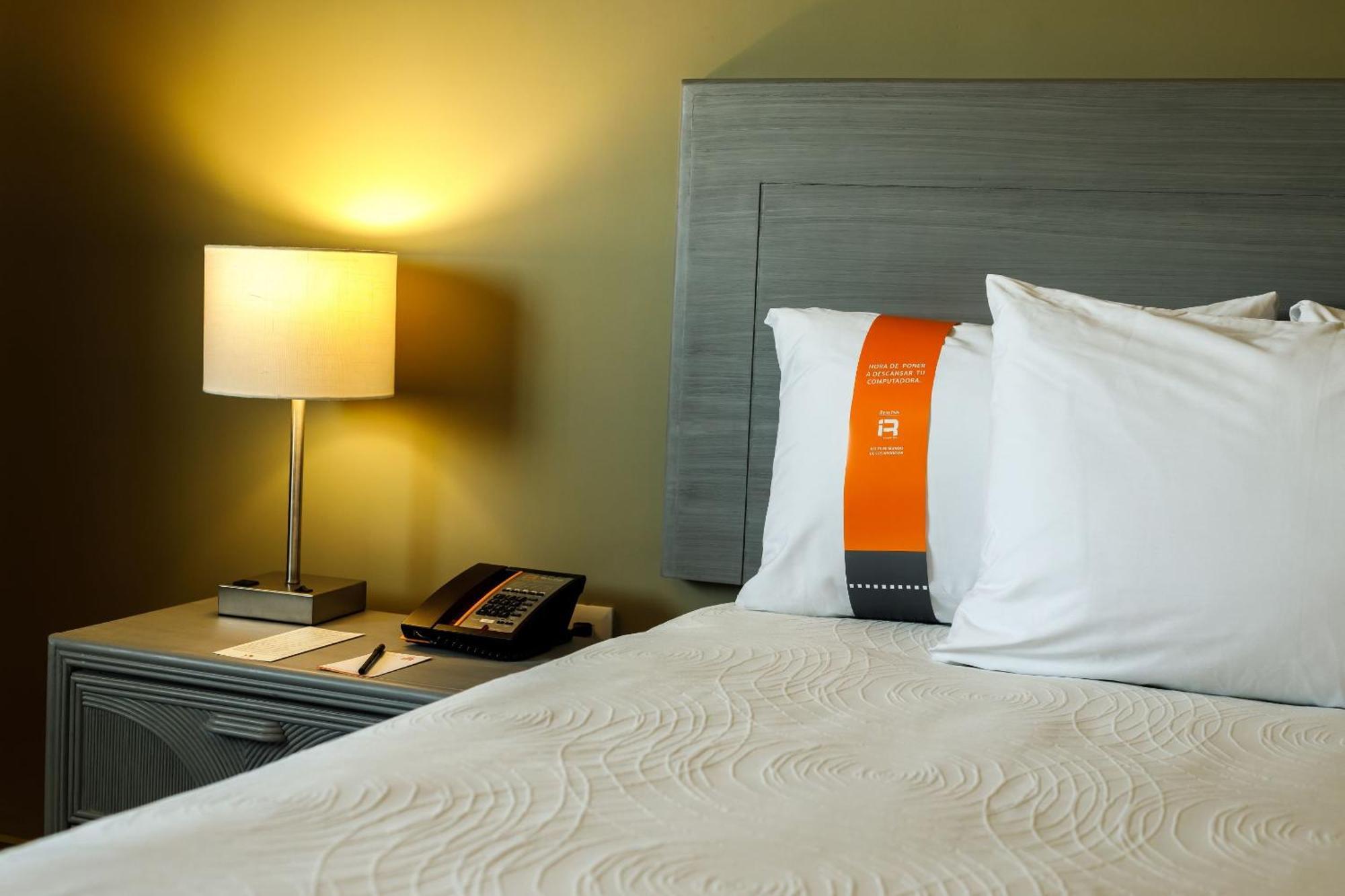 Real Inn Mexicali Exterior photo A pillow with a "soft" tag